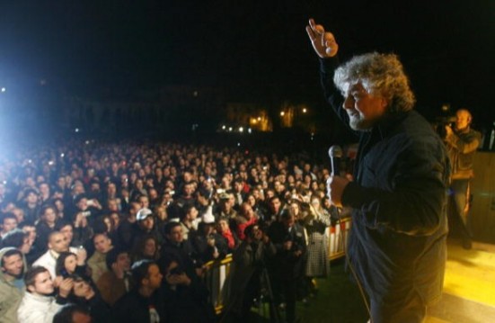 Italian showman Beppe Grillo gestures as