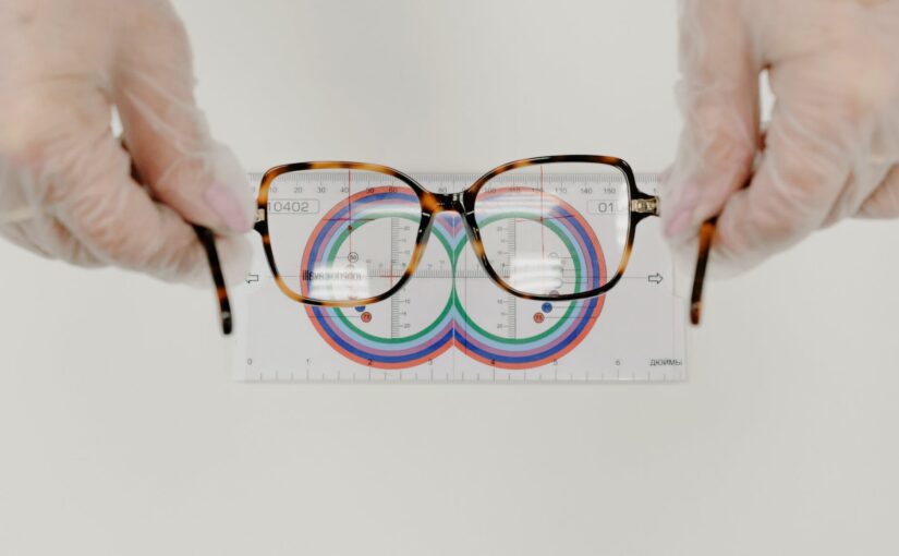 crop ophthalmologist measuring eyeglasses with lens ruler