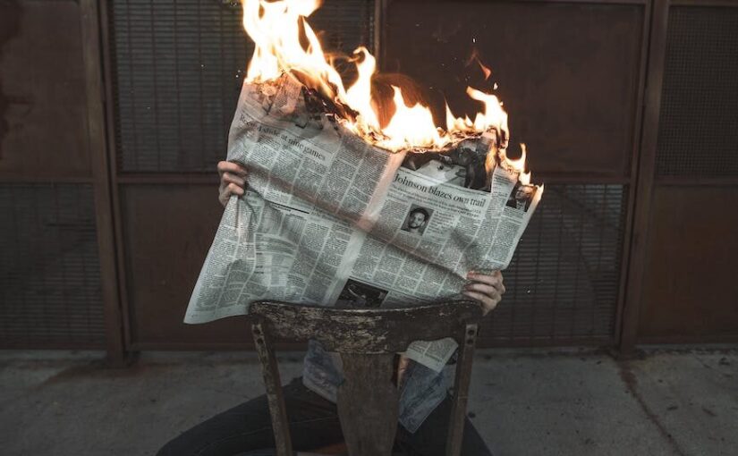 burning newspaper