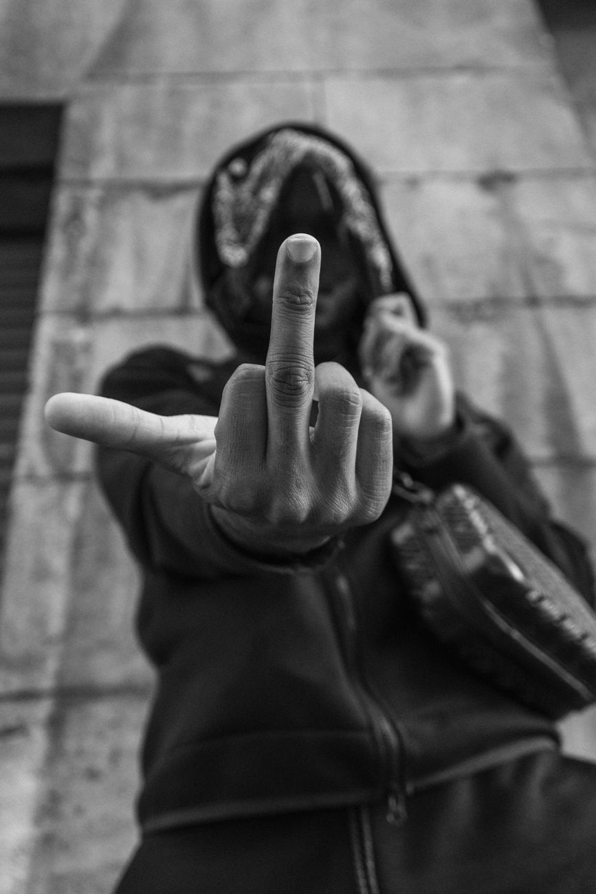 man showing middle finger